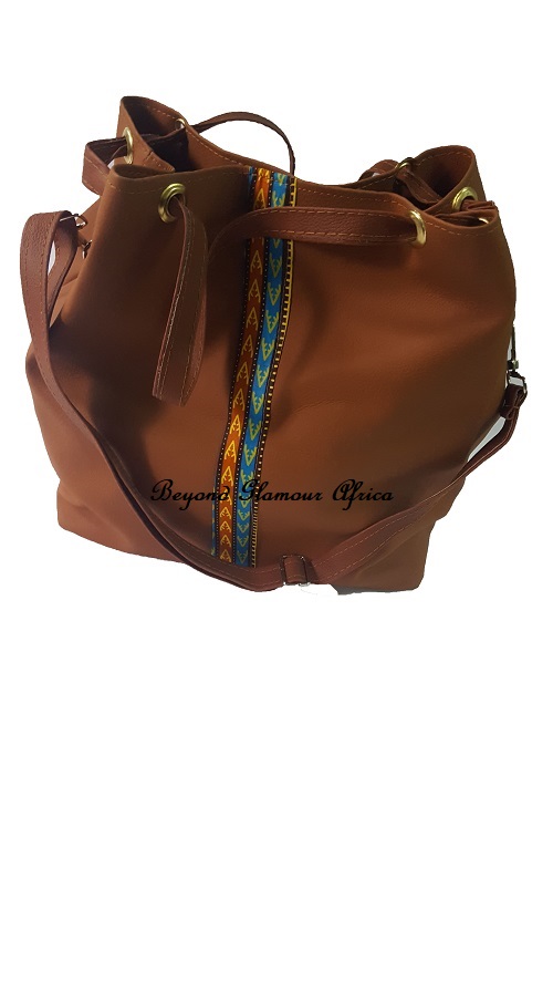 Introducing our stunning Brown Leather Handbag with a Touch of Ankara, where classic elegance meets vibrant African-inspired flair.