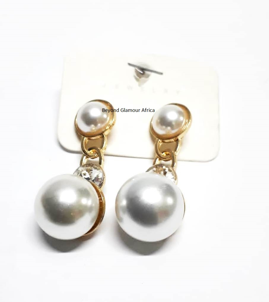 exquisite large white pearl earrings delicately accented with a touch of radiant gold