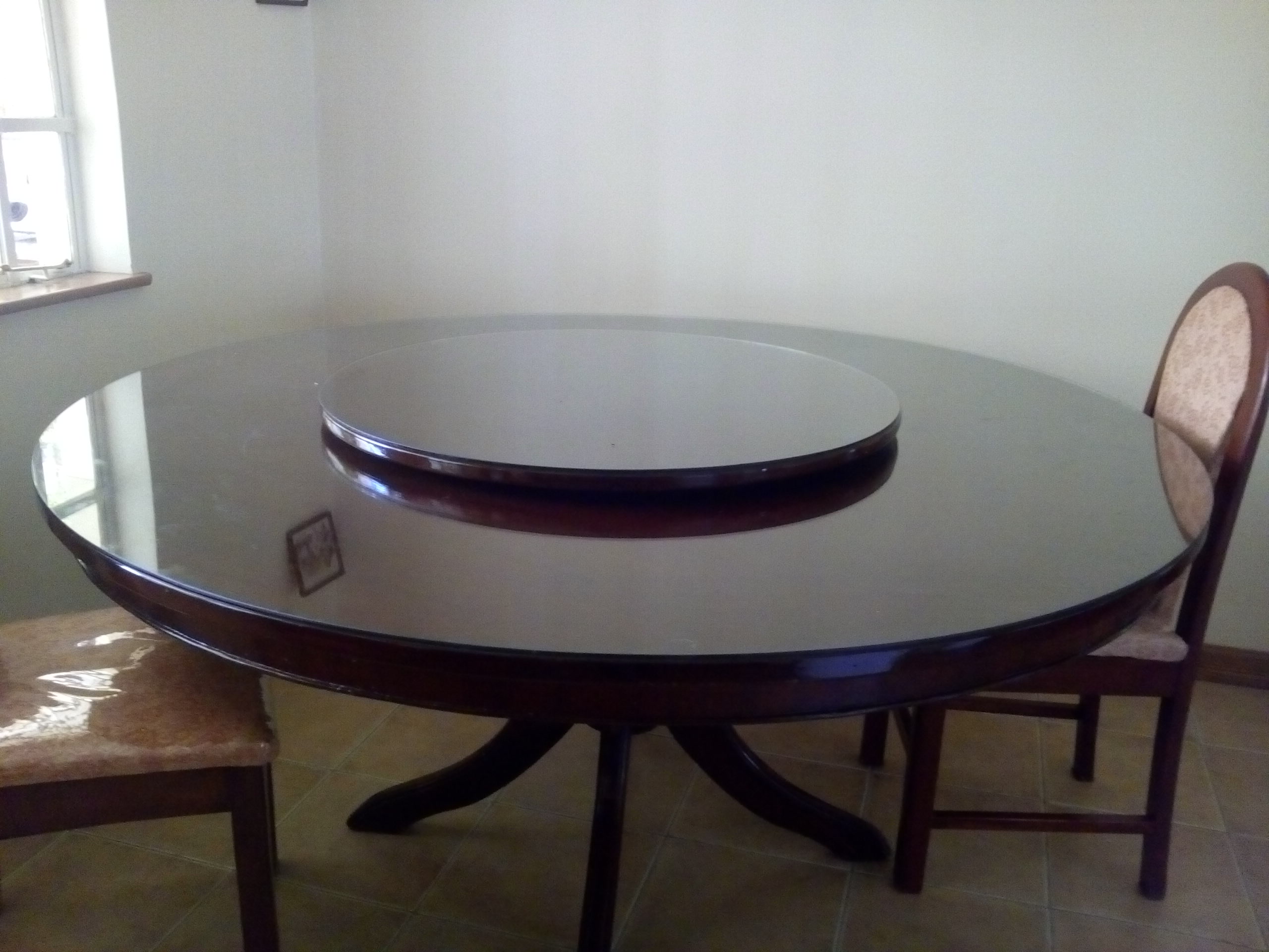 Tintin- Glass round rotating dining table with 8 chairs Quick sale