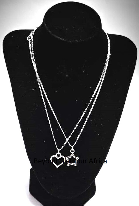 exquisite piece features a pair of pendants—a heart and a star