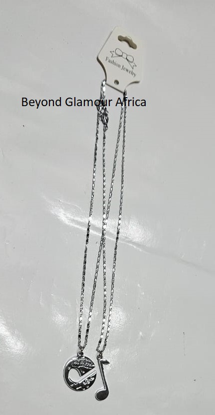 A double friendship chain with a moon and music sign