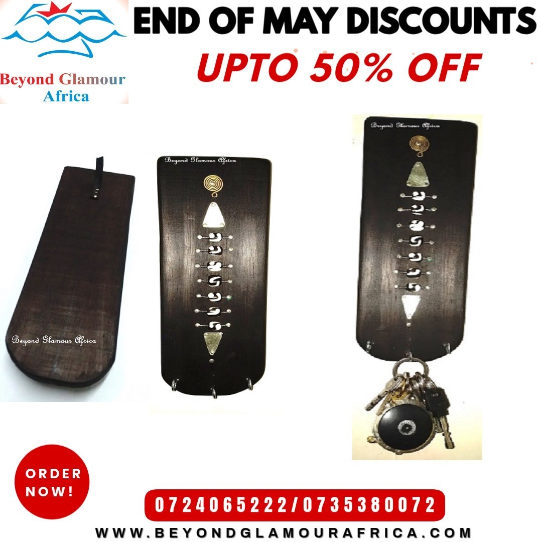 A black wall mounted wooden key holder very fashionable