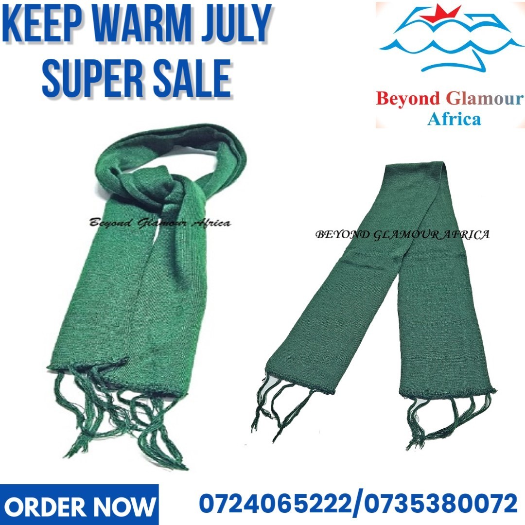 A green knitted scarf very fashionable and warm to have.