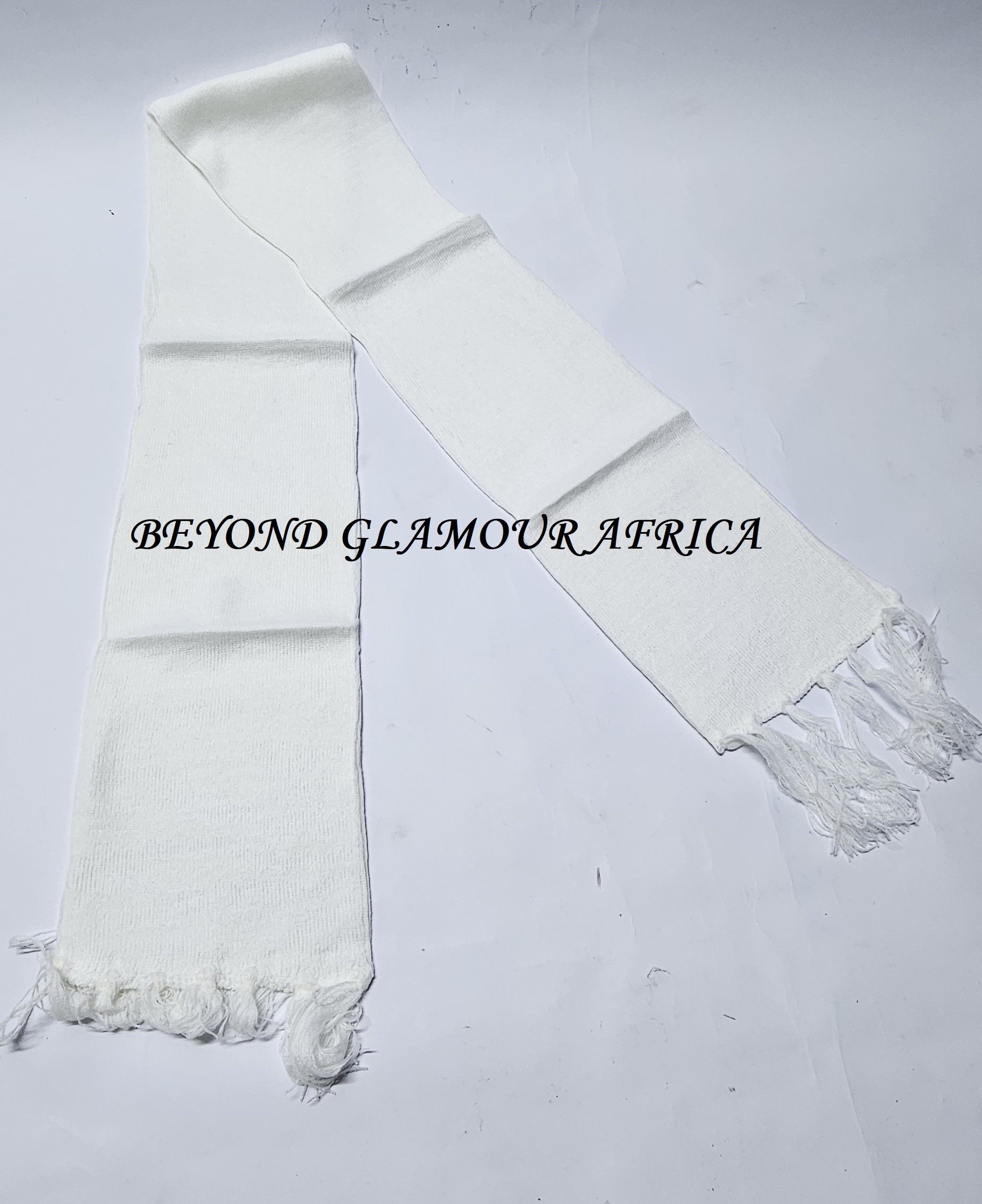 A plain white hand-knitted scarf