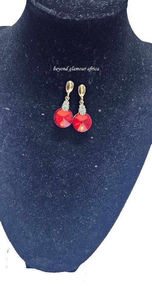 A ladies gorgeous drop down crystal red earrings