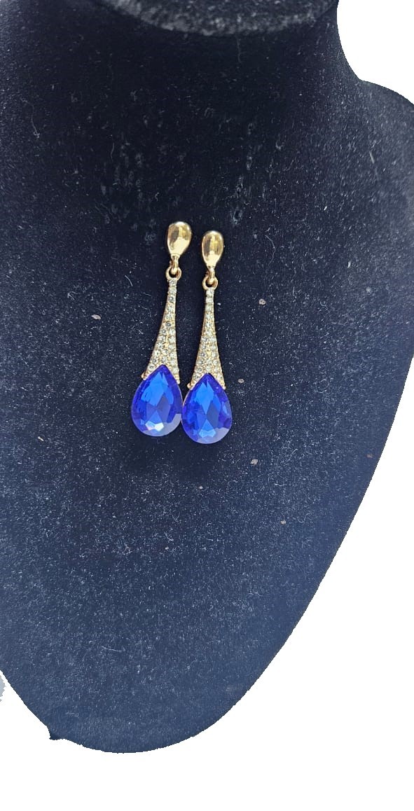 A ladies gorgeous drop down crystal blue earrings