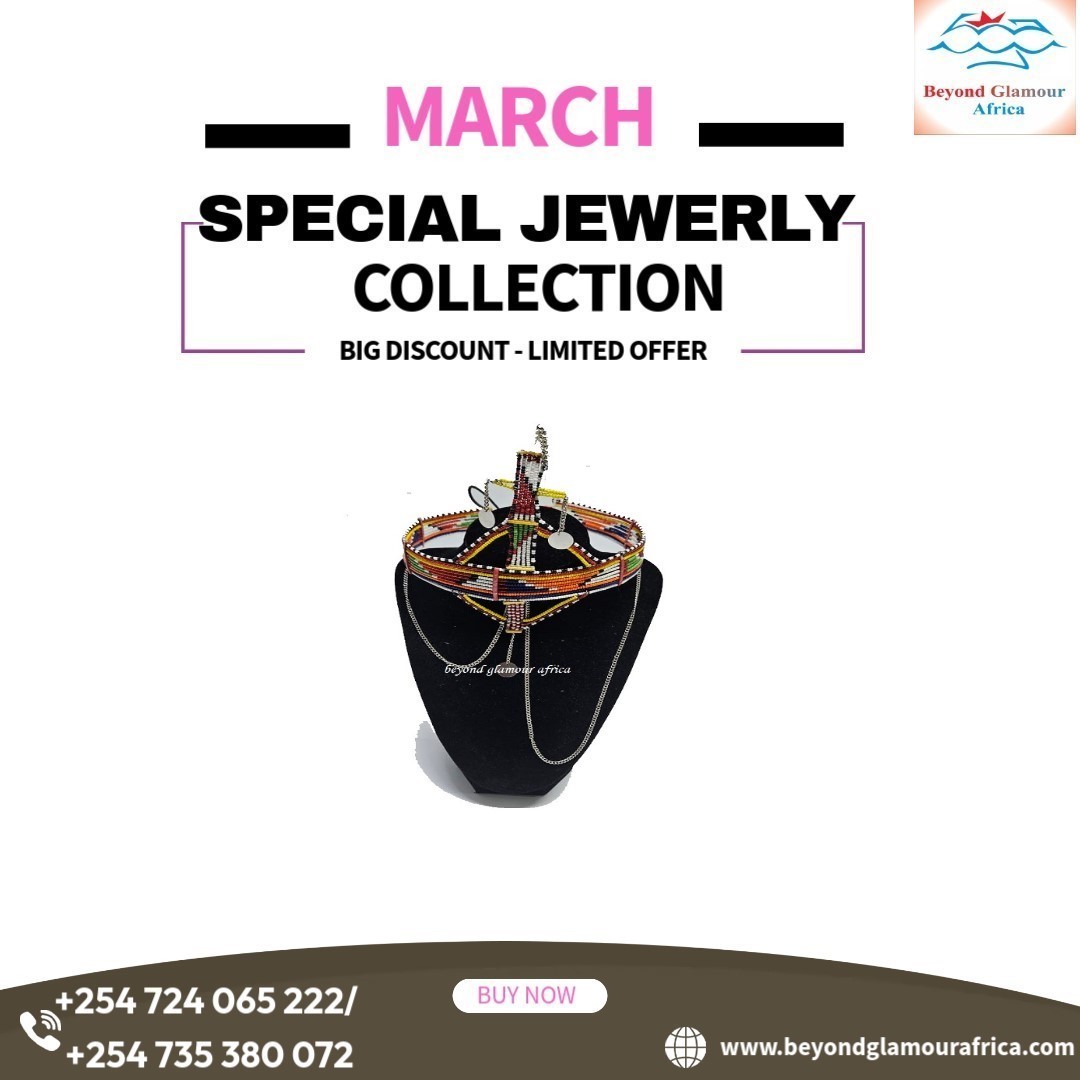 A big green red head gear with silver daggling decoration