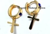 Small golden earrings with a cross design