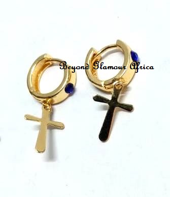 Small golden earrings with a cross design