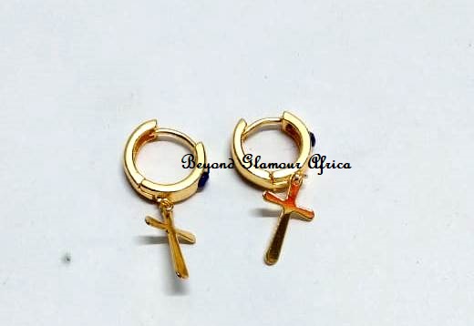 Small golden earrings with a cross design