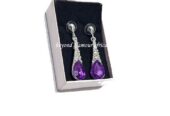 A fashionable purple drop down crystal earrings