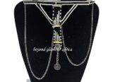 A black and white maasai head/face gear with some silver decorations