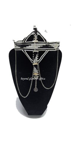 A black and white maasai head/face gear with some silver decorations