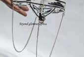 A black and white maasai head/face gear with some silver decorations
