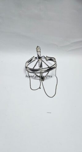 A black and white maasai head/face gear with some silver decorations
