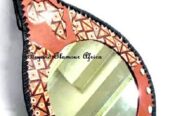 A customized brown leather African mirror