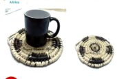 A hand woven black and white coaster