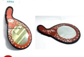 A customized brown leather mirror very fashionable to have