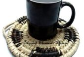 A hand woven black and white coaster