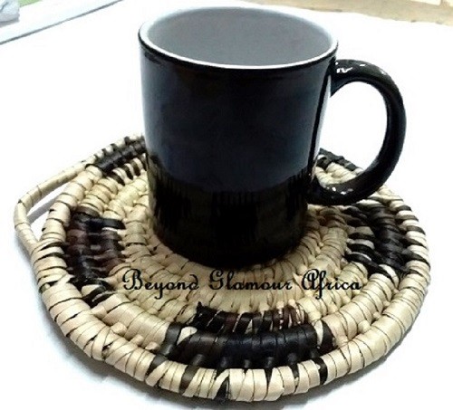 A hand woven black and white coaster