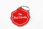 A multi colored sunhat and a red Manchester united keyholder combo