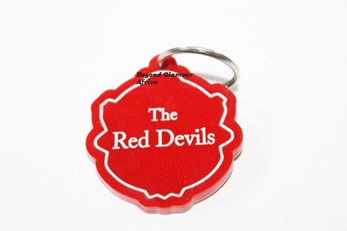 A multi colored sunhat and a red Manchester united keyholder combo