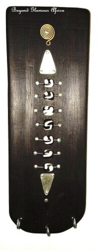 A black wall mounted wooden key holder very fashionable