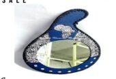 A blue leather calabash mirror very fashionable to have
