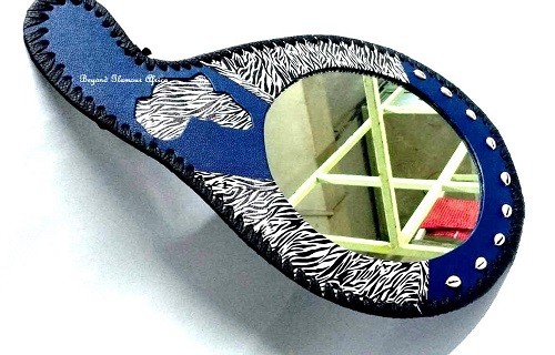 A blue leather calabash mirror very fashionable to have
