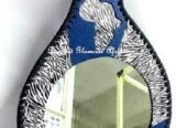 A blue leather calabash mirror very fashionable to have