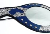 A blue leather calabash mirror very fashionable to have