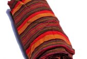 A black and red sling bag and an orange brown maasai shuka combo