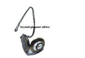 A vintage locket watch and a black waist bag combo very fashionable to have