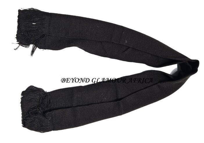 A black knitted scarf and a black waist bag combo very fashionable to have