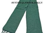 A green knitted scarf very fashionable and warm to have.