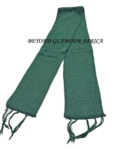 A green knitted scarf very fashionable and warm to have.