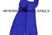 A blue knitted scarf and a blue pink sling bag combo very fashionable to have