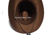 A brown cowboy hat and a brown keyholder combo very fashionable to have