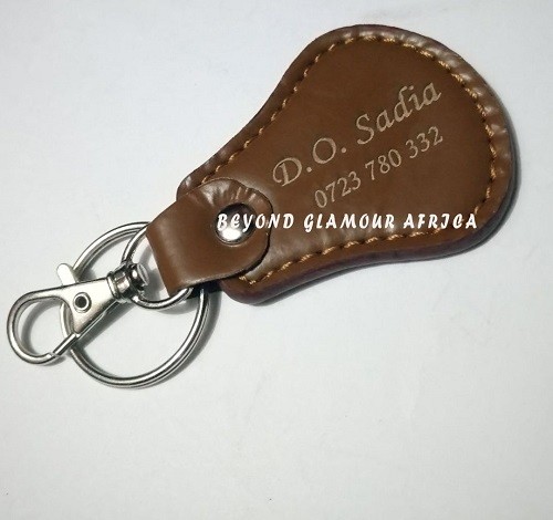 A brown cowboy hat and a brown keyholder combo very fashionable to have