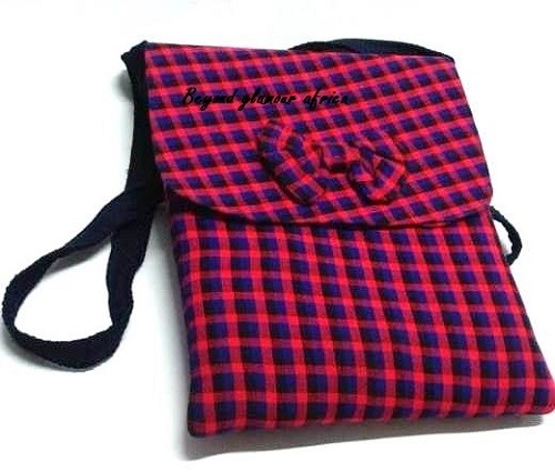 A blue knitted scarf and a blue pink sling bag combo very fashionable to have