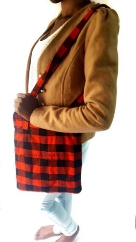 A black and red sling bag and an orange brown maasai shuka combo