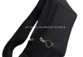 A vintage locket watch and a black waist bag combo very fashionable to have
