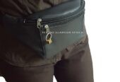 A vintage locket watch and a black waist bag combo very fashionable to have